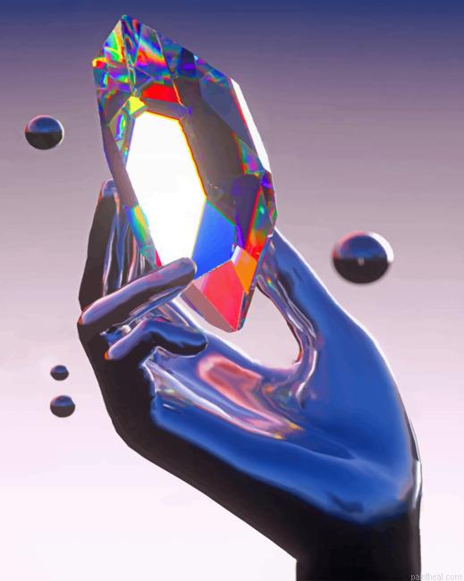 A silver hand holds crystal painting by numbers.jpeg
